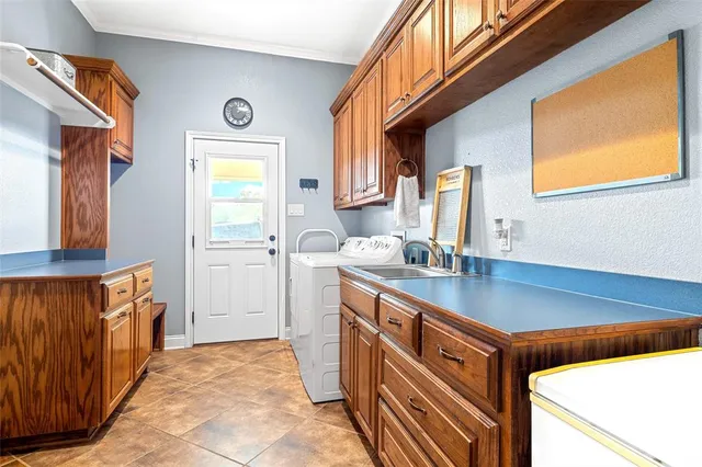 a kitchen with stainless steel appliances granite countertop a sink and a stove next to a window