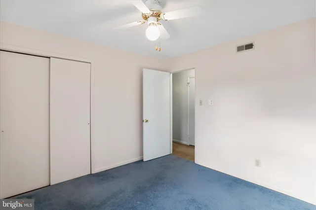 a view of a chandelier fan in a room