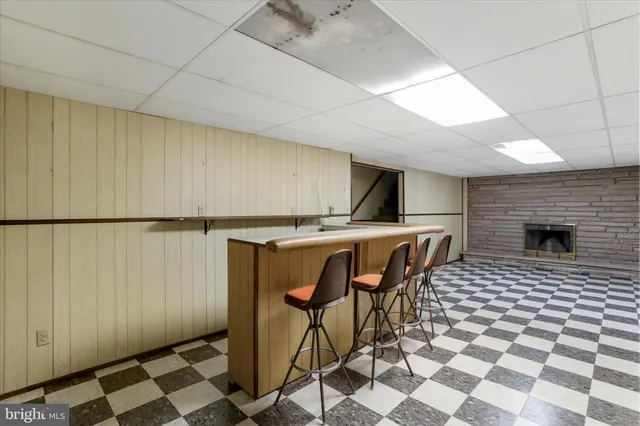 a view of a livingroom with furniture and an entryway
