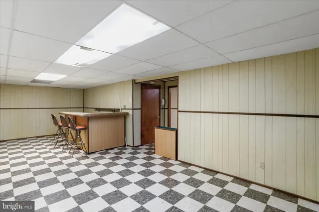 a view of a storage & utility room with a sink