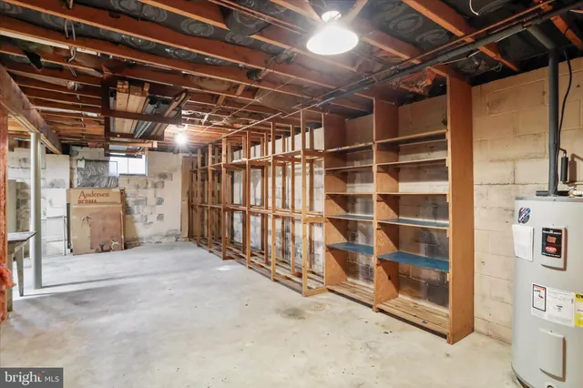 a view of an empty room with wooden walls