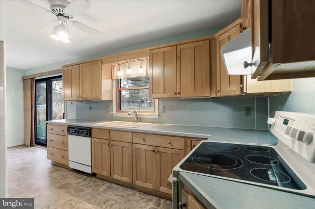 a kitchen with a stove and a sink