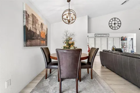 a dining room with furniture and window