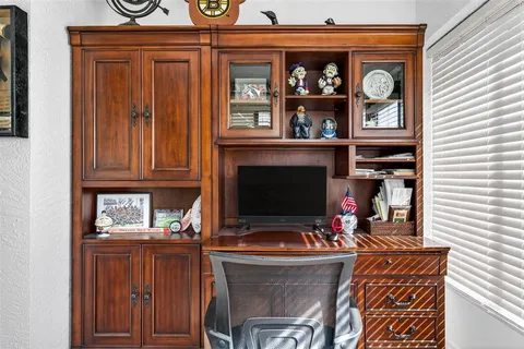 a living room with fireplace furniture and a window