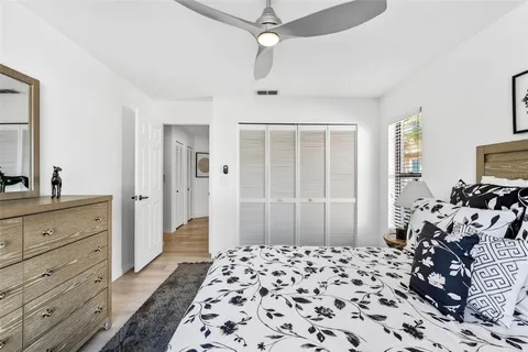 a bedroom with a bed and a dresser