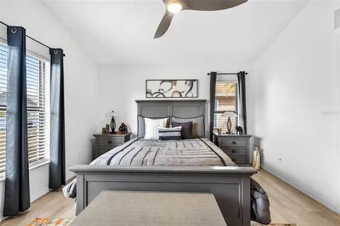 a bedroom with a bed and a table in it