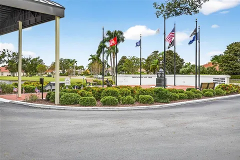 a front view of a house with a garden and plants