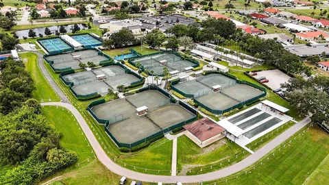 an aerial view of residential house with outdoor space and swimming pool