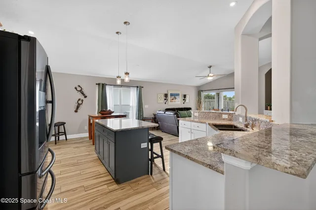 a kitchen with counter top space and stainless steel appliances