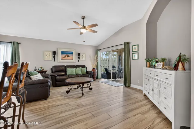 a bed room with furniture and windows