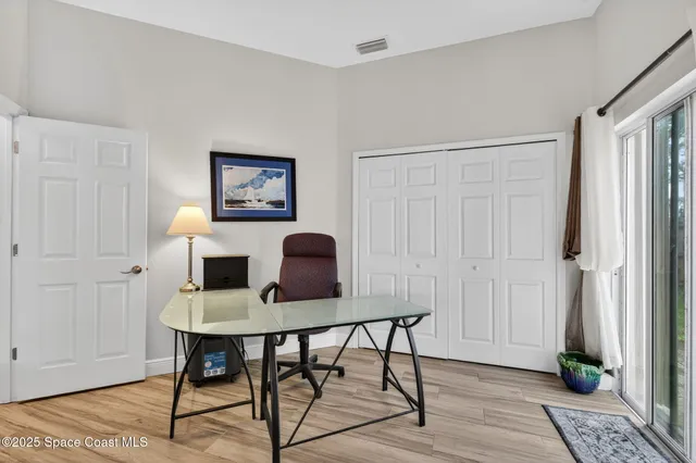 a workspace with furniture and wooden floor