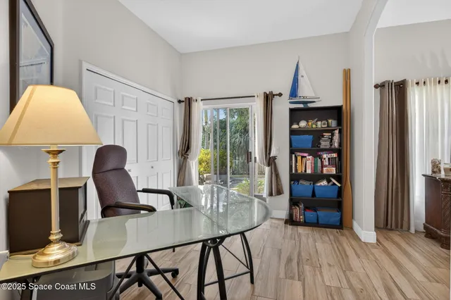 a workspace with furniture window and wooden floor