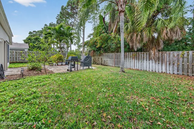 a view of a chair and table and chairs in the garden