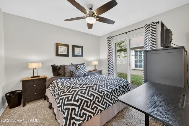 a bedroom with a bed and a desk