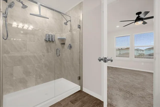 a bathroom with a bathtub and a shower