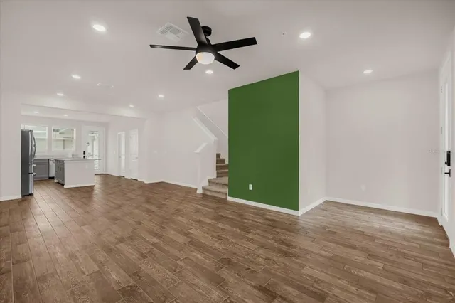 a view of a livingroom with a kitchen