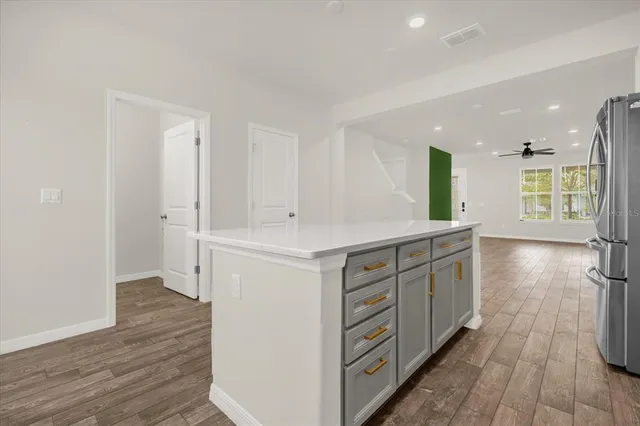 a kitchen with a sink and a stove top oven
