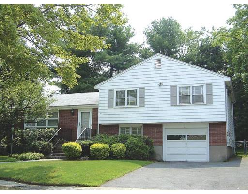 20 Wendell Road Newton, MA 02459 - Photo 1 of 11 a front view of a house with a garden and plants