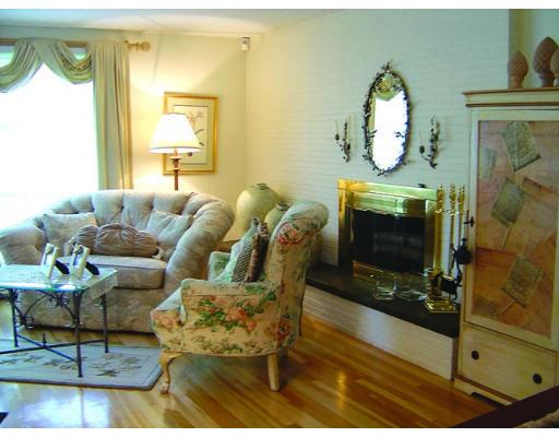 20 Wendell Road Newton, MA 02459 - Photo 3 of 11 a living room with furniture a fireplace and a large window