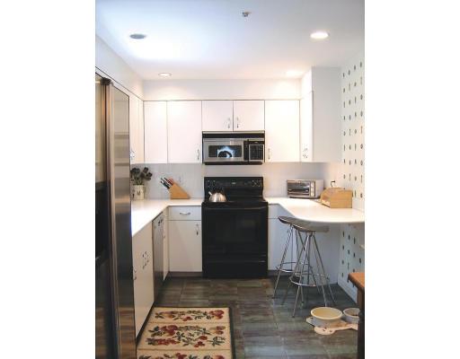 20 Wendell Road Newton, MA 02459 - Photo 8 of 11 a kitchen with a sink a stove and a refrigerator