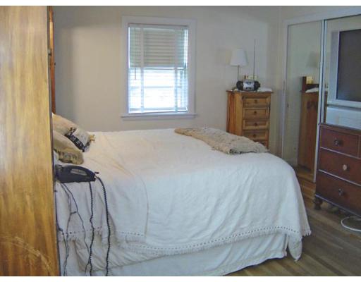 20 Wendell Road Newton, MA 02459 - Photo 9 of 11 a bedroom with a bed and wooden floor