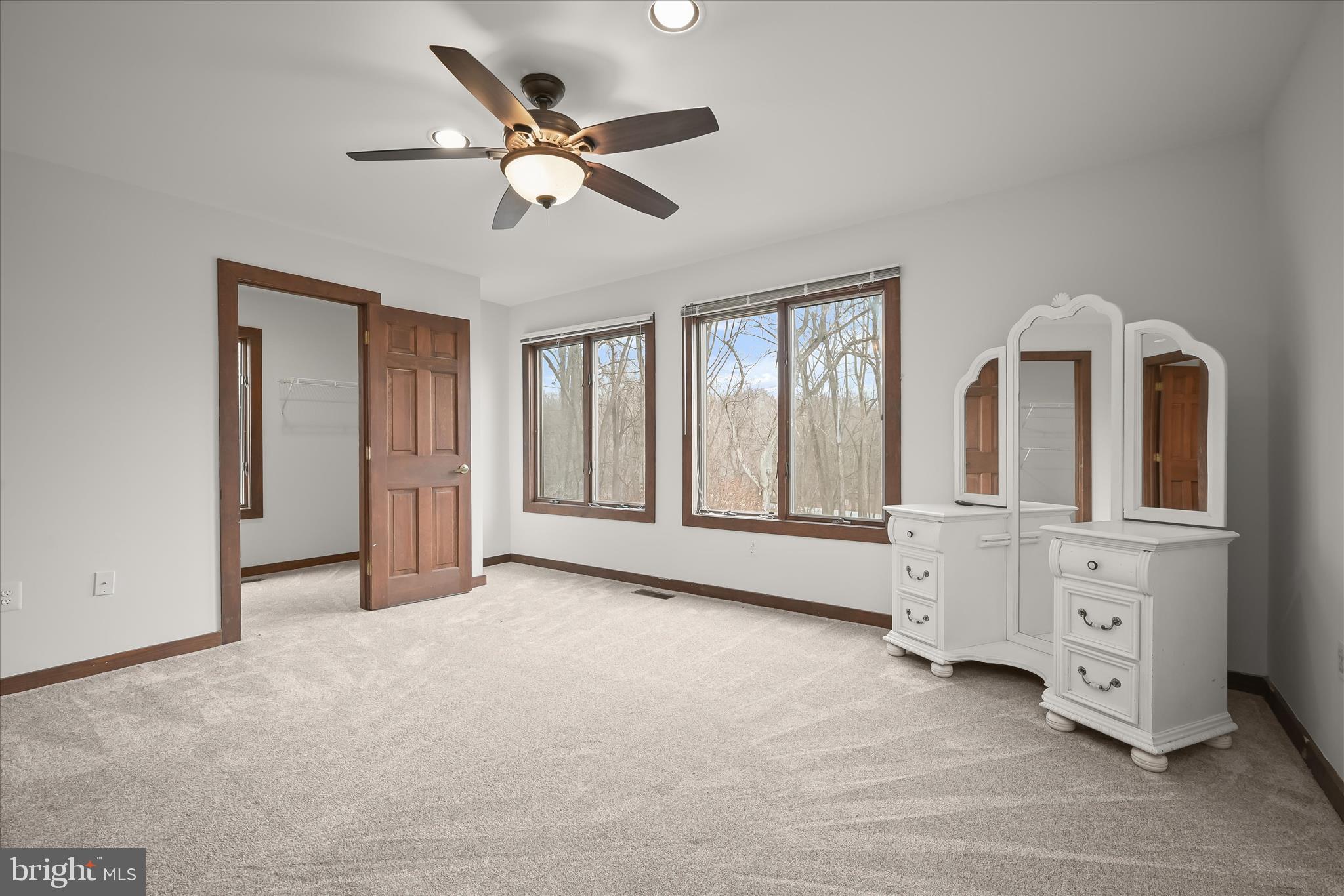 13304 Ridgewood Drive Ellicott City, MD 21042 - Photo 39 of 95 a view of an empty room with cabinet and windows