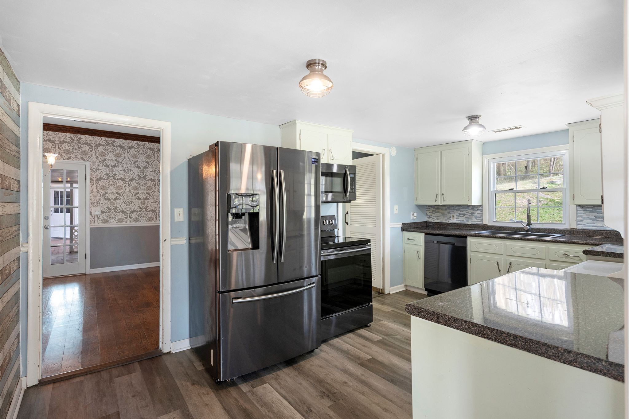 420 Beechwood Road Bell Buckle, TN 37020 - Photo 18 of 57 a kitchen with granite countertop a refrigerator and a stove top oven