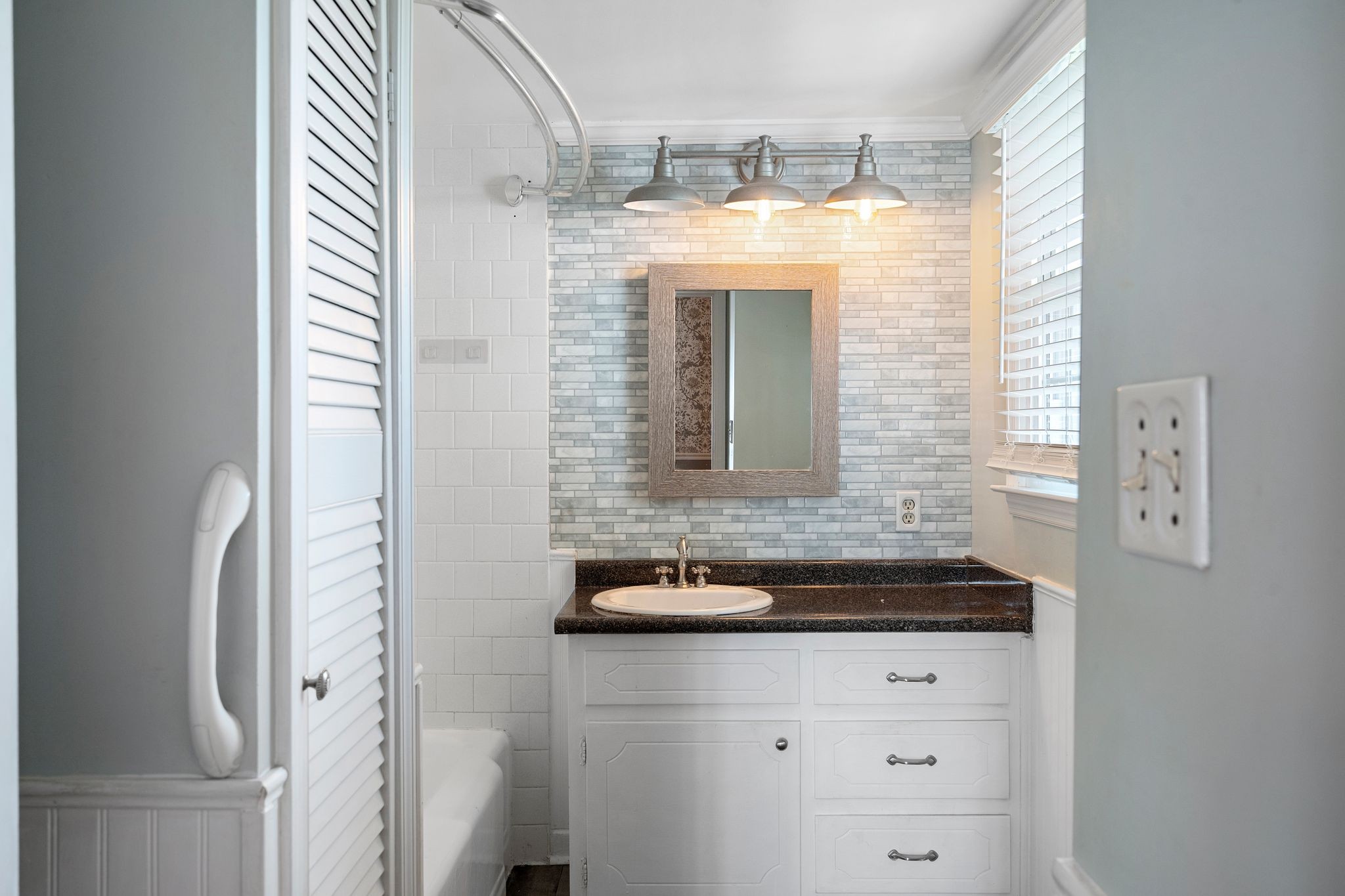 420 Beechwood Road Bell Buckle, TN 37020 - Photo 24 of 57 a bathroom with a granite countertop sink and a mirror