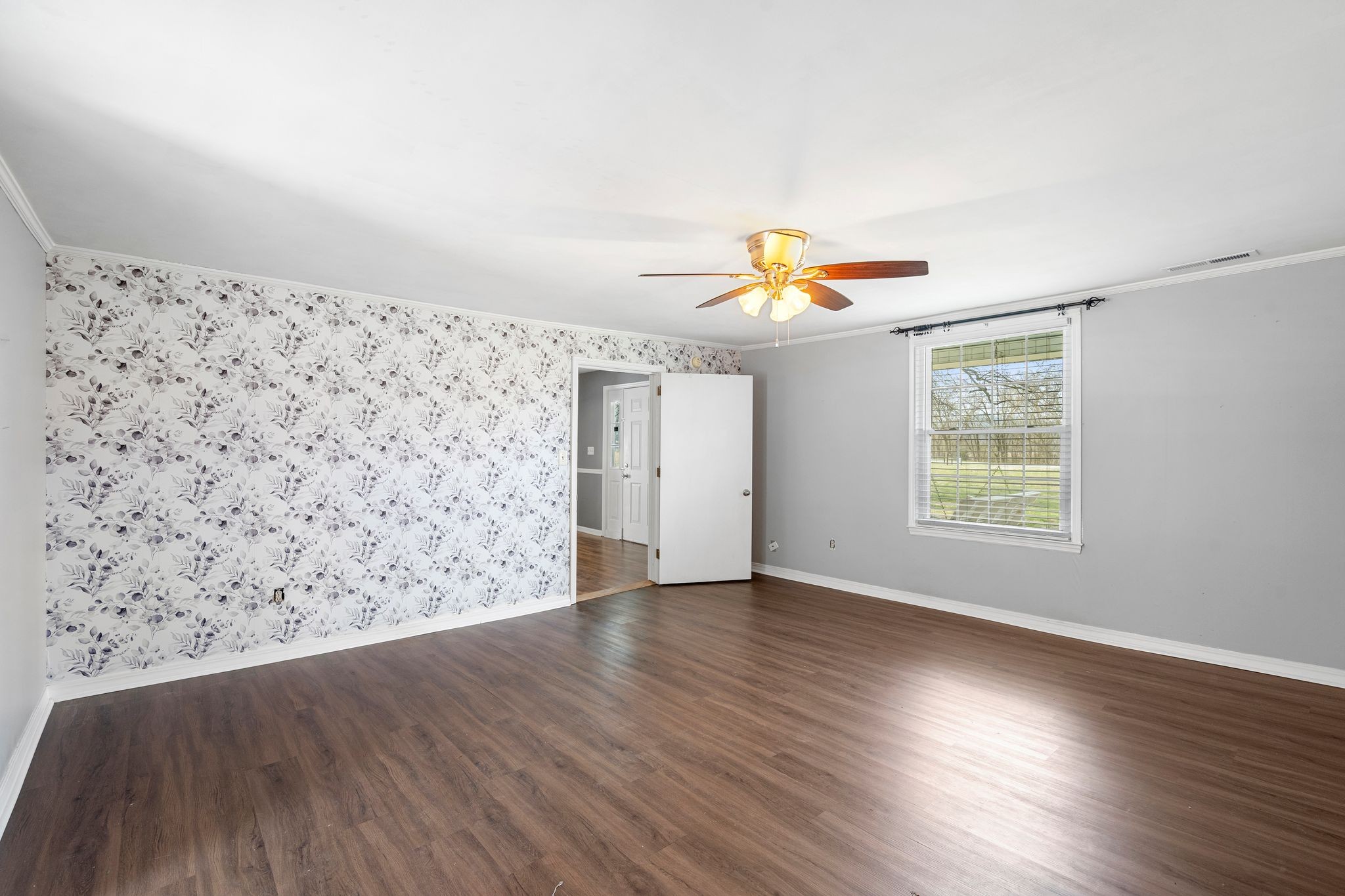 420 Beechwood Road Bell Buckle, TN 37020 - Photo 27 of 57 an empty room with wooden floor and windows