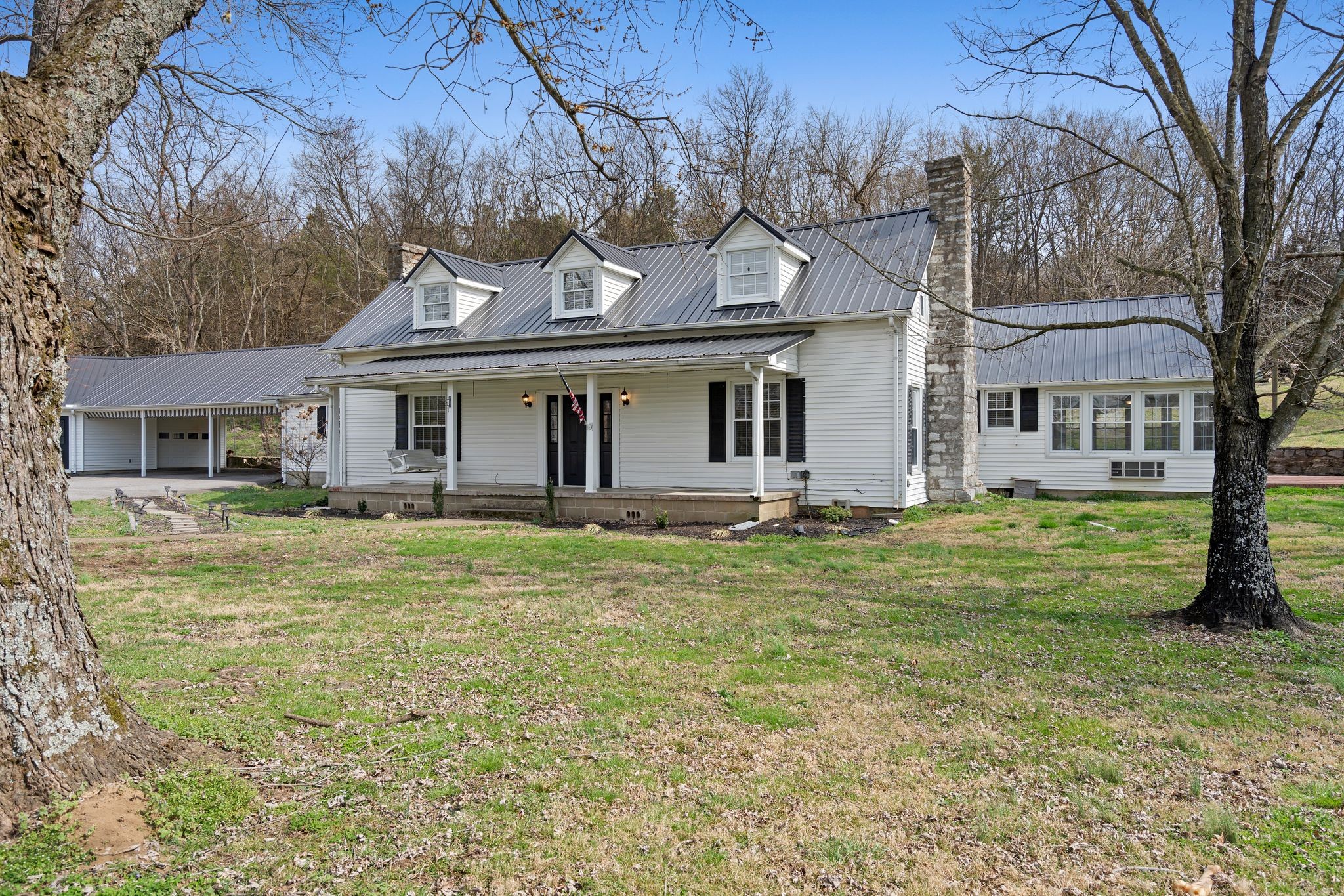420 Beechwood Road Bell Buckle, TN 37020 - Photo 5 of 57 a front view of a house with a garden