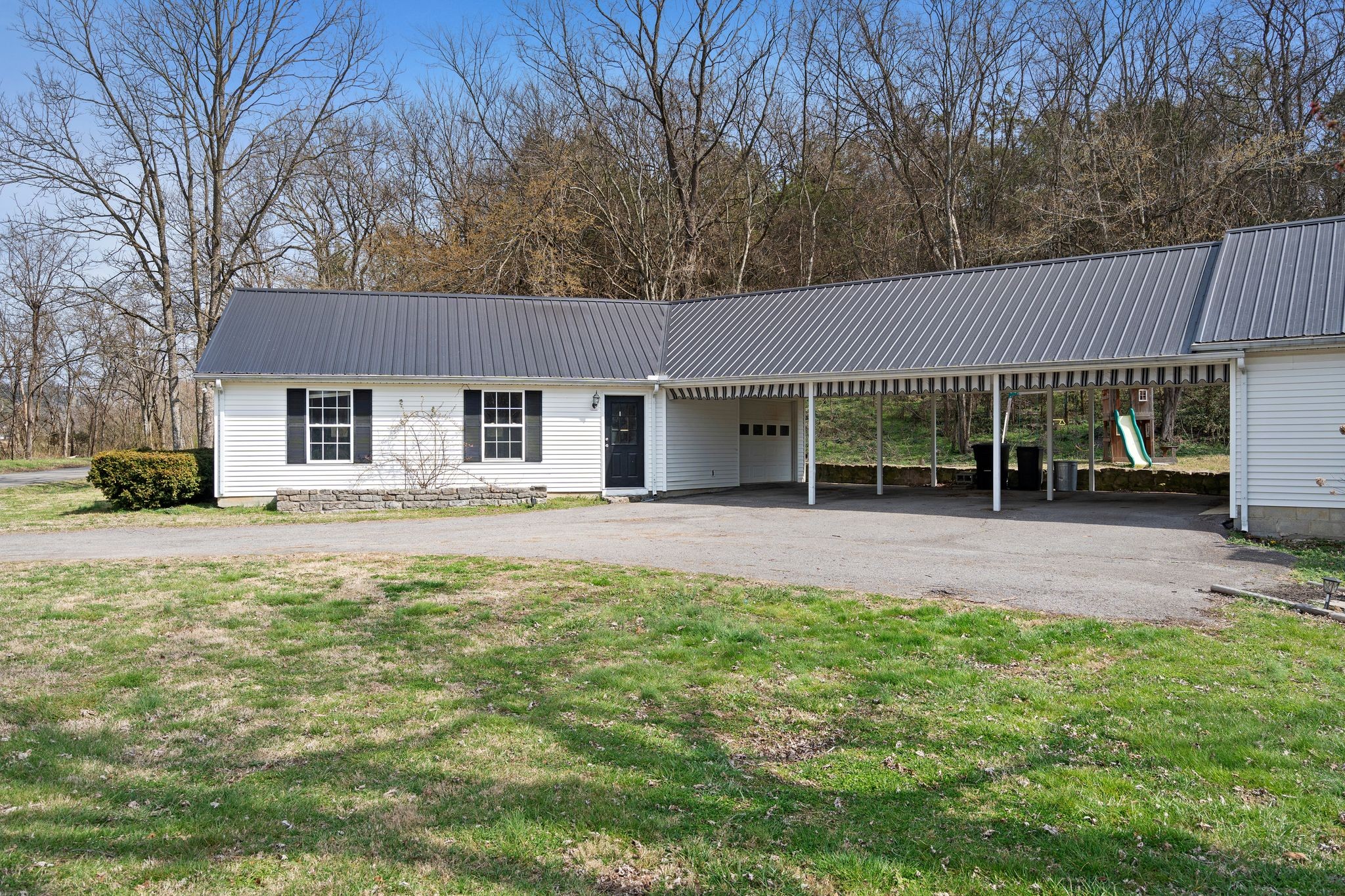 420 Beechwood Road Bell Buckle, TN 37020 - Photo 6 of 57 a front view of a house with a garden and porch