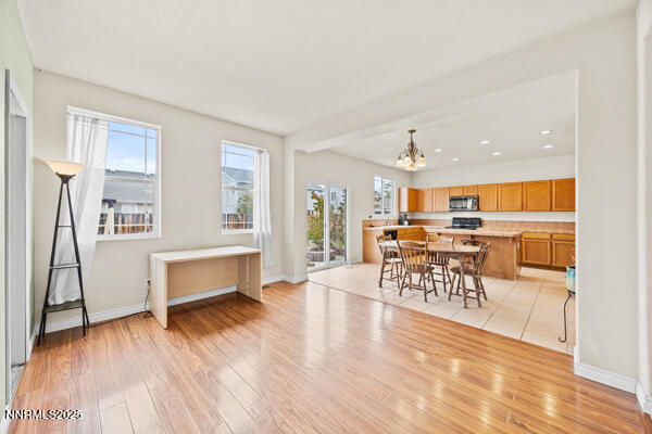 8994 Wynne Street Reno, NV 89506 - Photo 11 of 26 a living room with furniture and kitchen view with wooden floor
