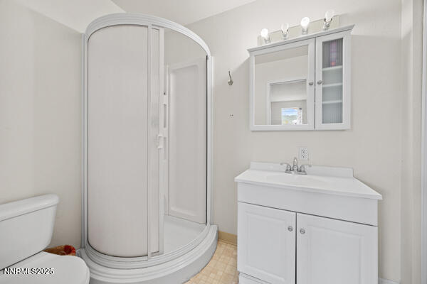 8994 Wynne Street Reno, NV 89506 - Photo 17 of 26 a bathroom with a sink toilet and shower