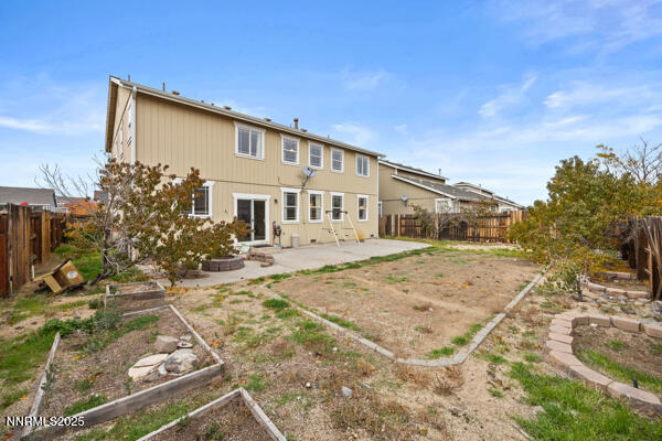 8994 Wynne Street Reno, NV 89506 - Photo 26 of 26 a front view of a house with a yard