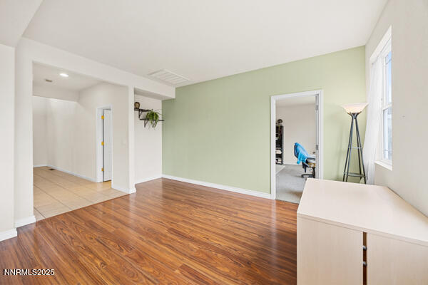 8994 Wynne Street Reno, NV 89506 - Photo 8 of 26 a view of a livingroom with wooden floor and furniture