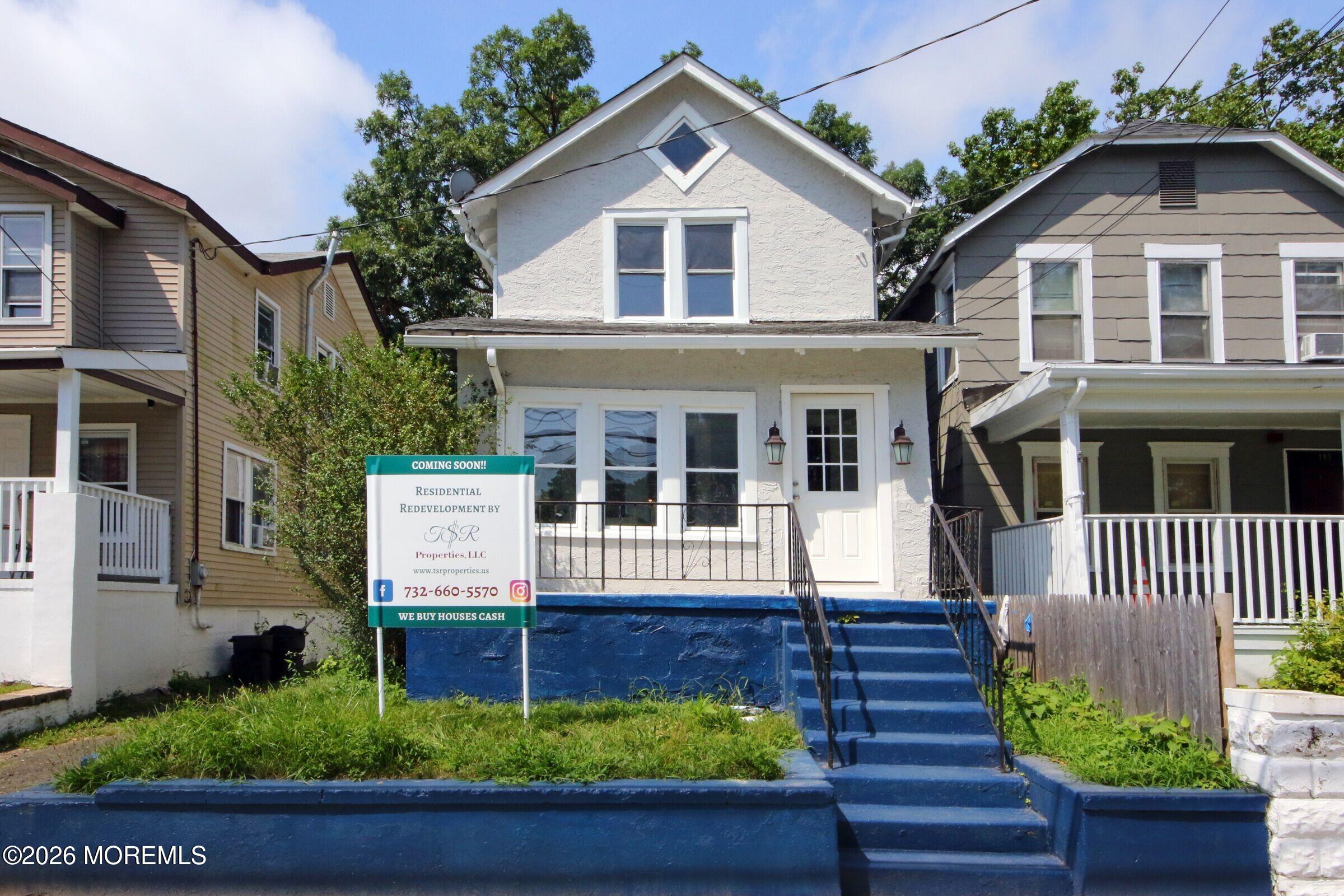 183 Ridge Avenue Asbury Park, NJ 07712 - Photo 22 of 23 a front view of a house with a yard