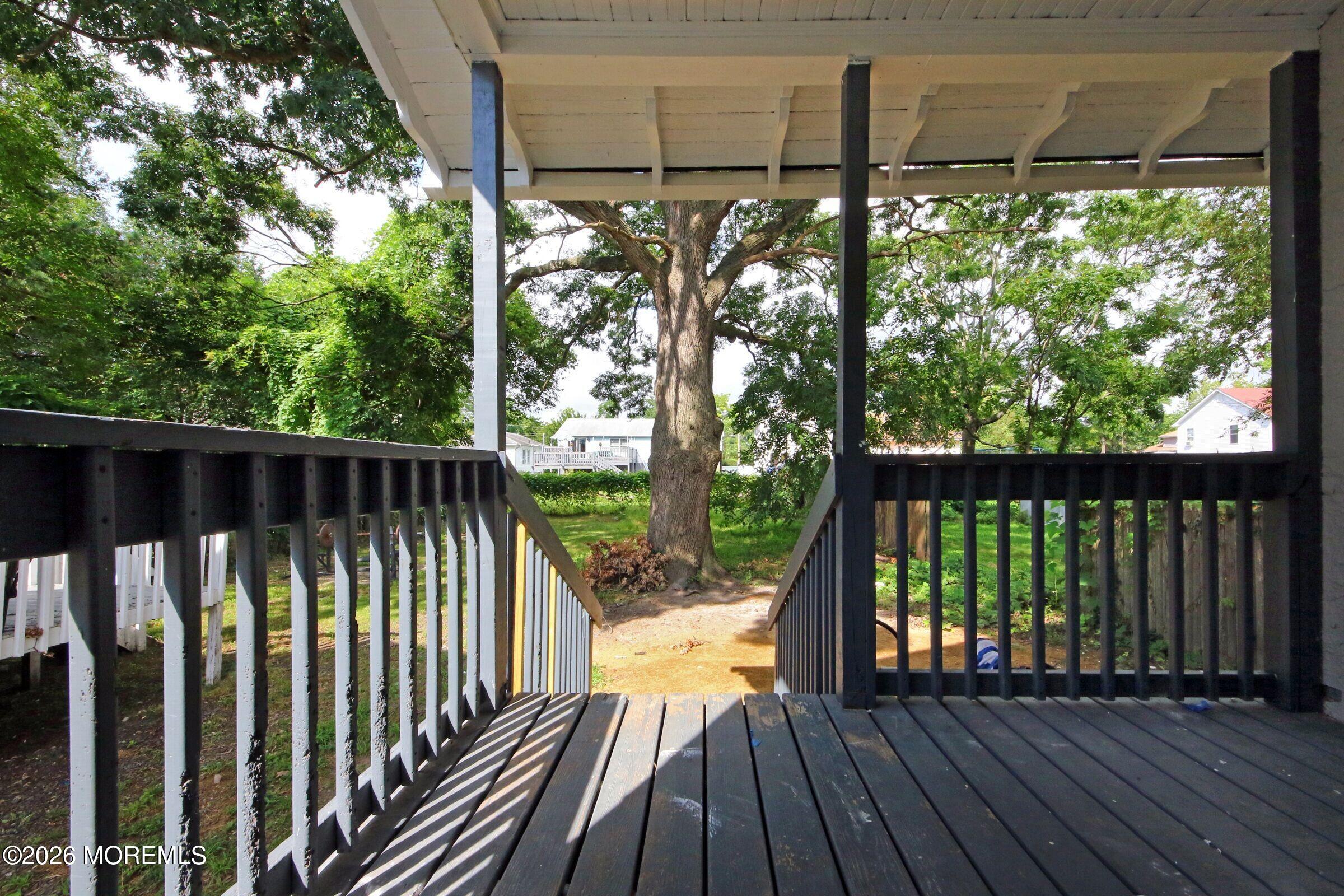 183 Ridge Avenue Asbury Park, NJ 07712 - Photo 6 of 23 a view of balcony with wooden floor