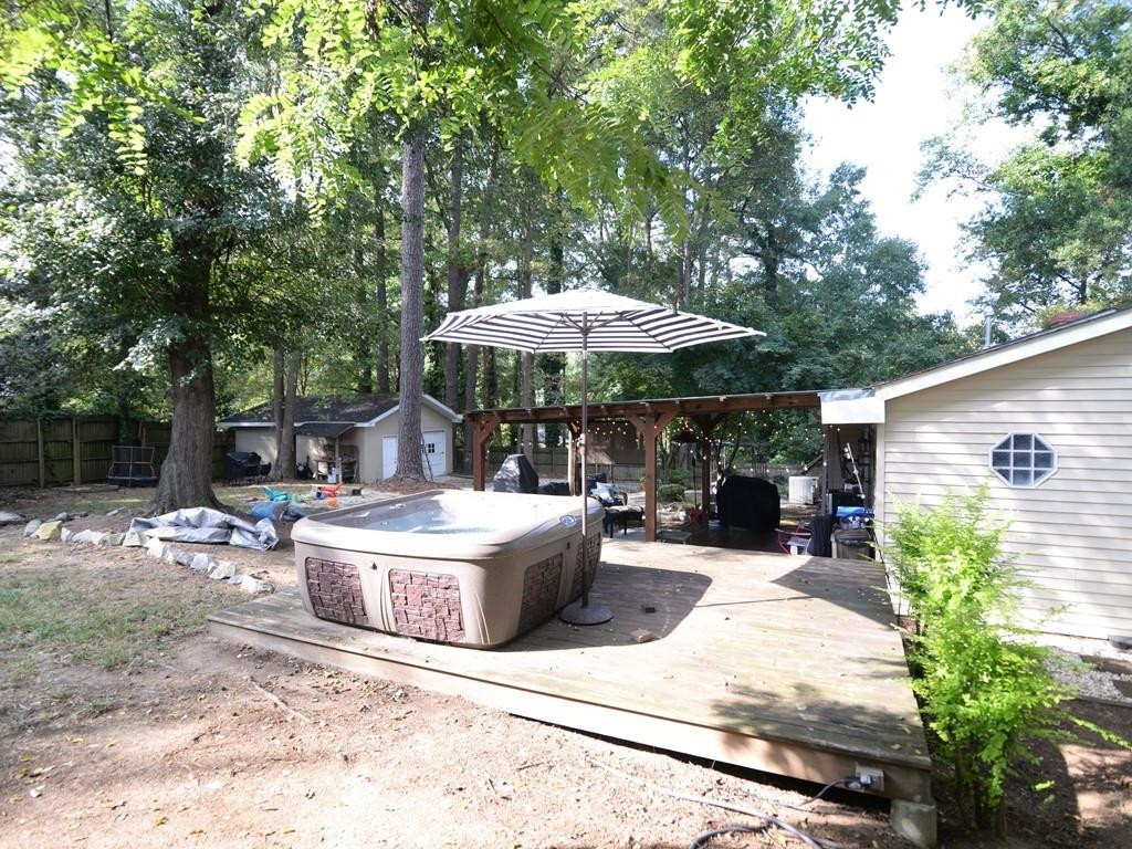 1023 Legend Road Raleigh, NC 27603 - Photo 25 of 30 The pergola is a beautiful place to sit out and relax. Backyard