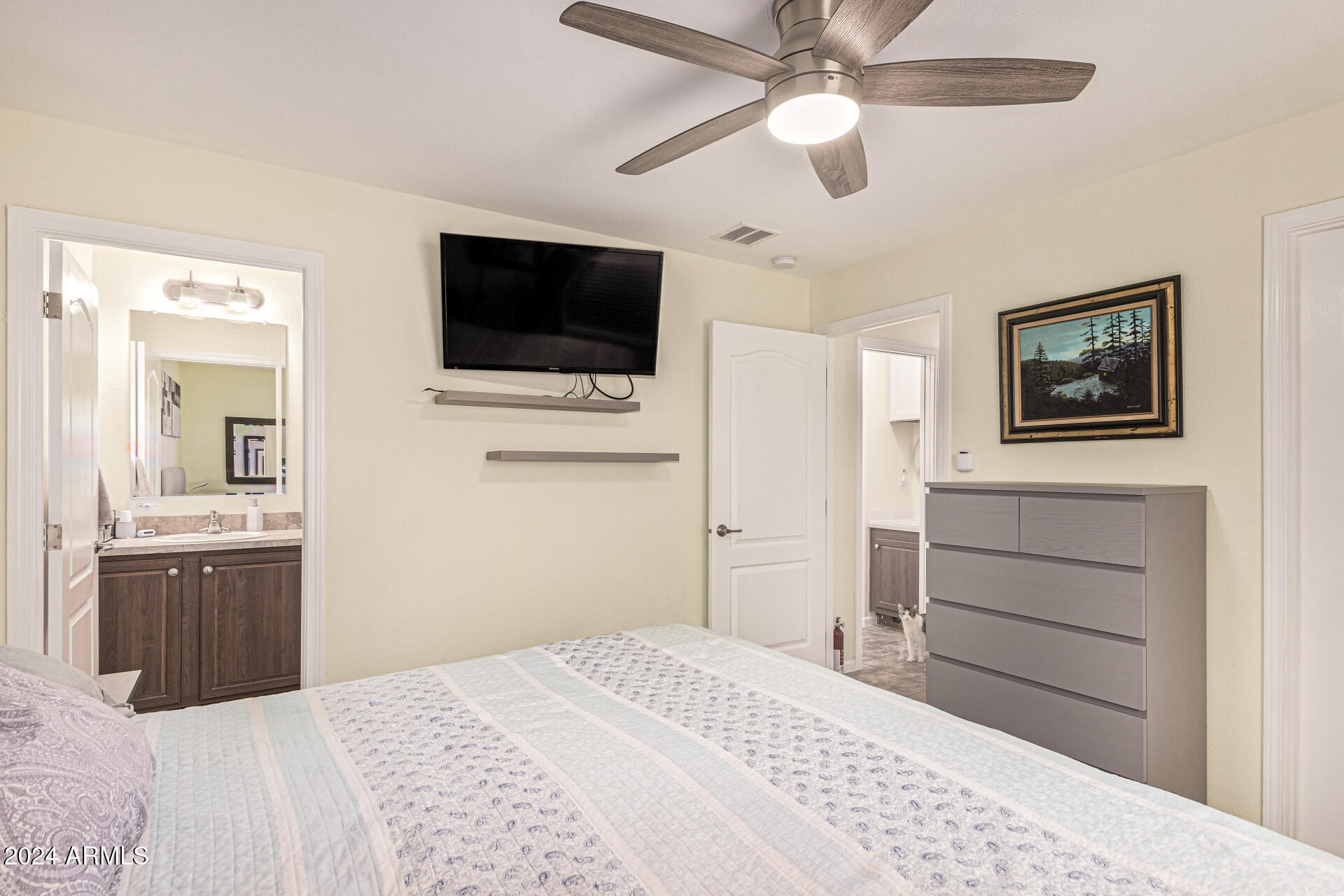 10220 East Apache Trail, Unit 213 Apache Junction, AZ 85120 - Photo 12 of 30 a bedroom with a bed and a flat screen tv