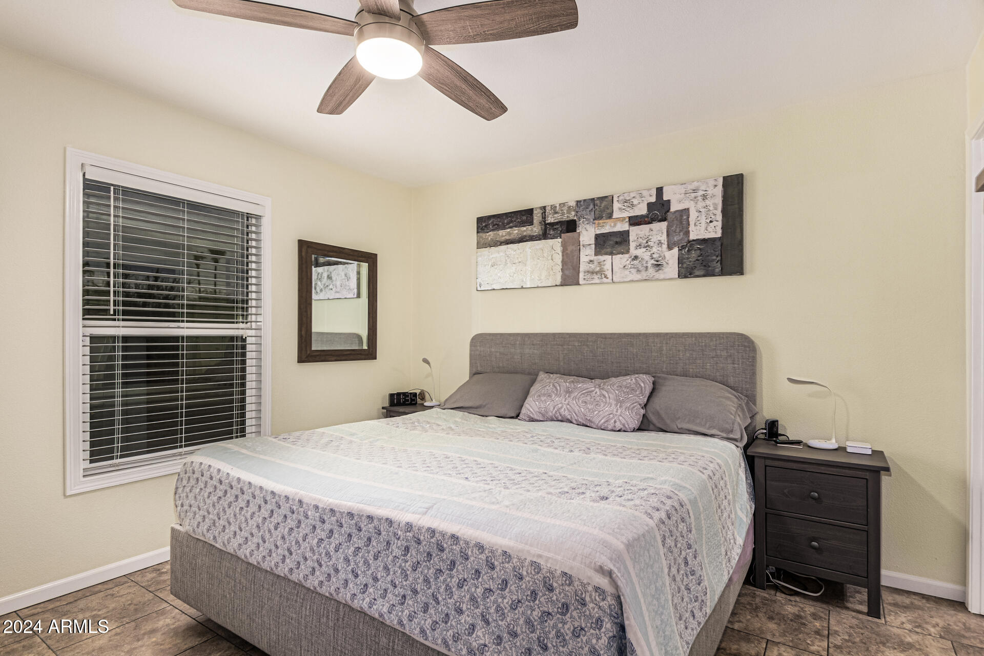 10220 East Apache Trail, Unit 213 Apache Junction, AZ 85120 - Photo 13 of 30 a bedroom with a bed and window