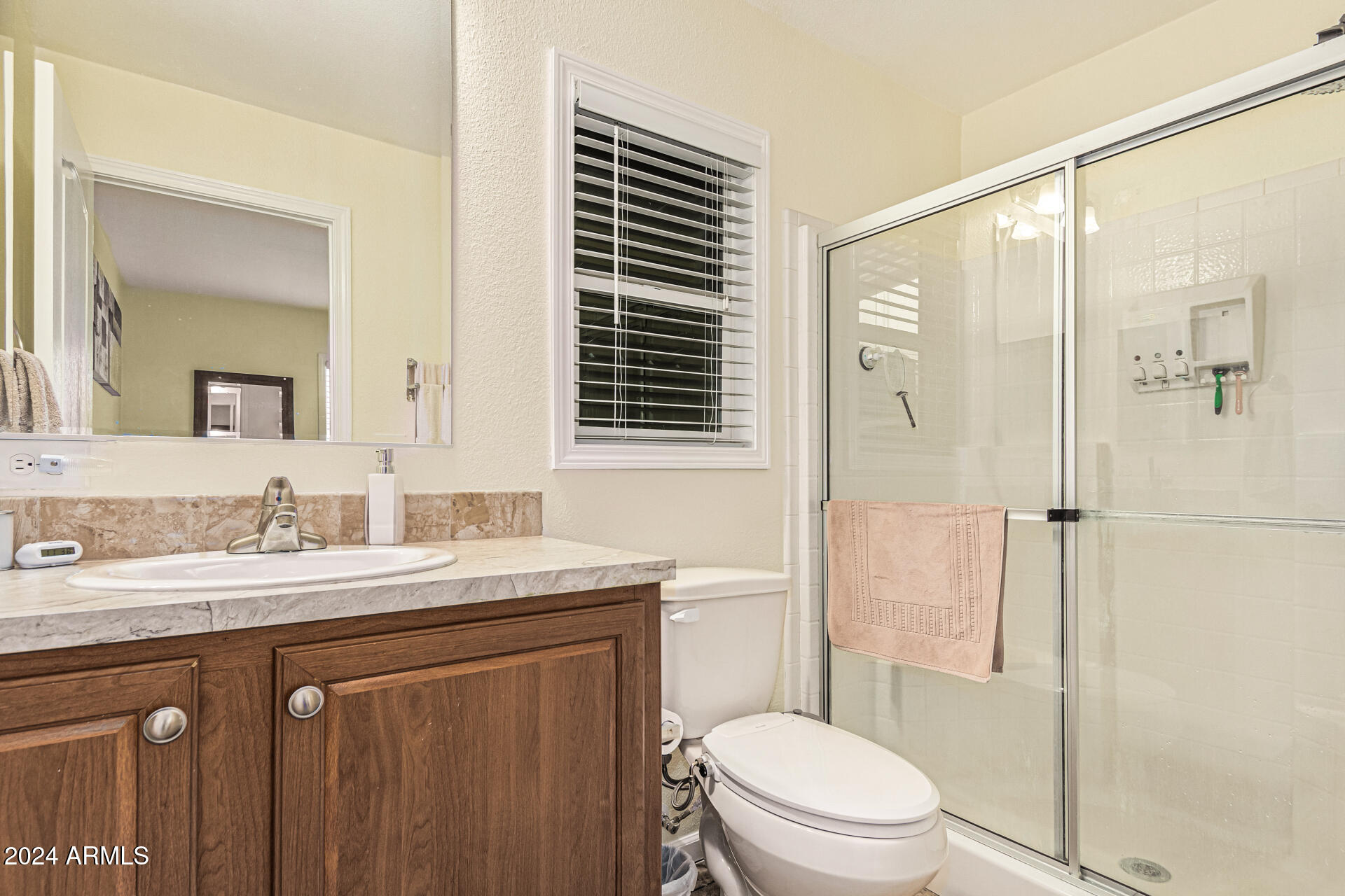 10220 East Apache Trail, Unit 213 Apache Junction, AZ 85120 - Photo 14 of 30 a bathroom with a granite countertop sink toilet mirror and shower