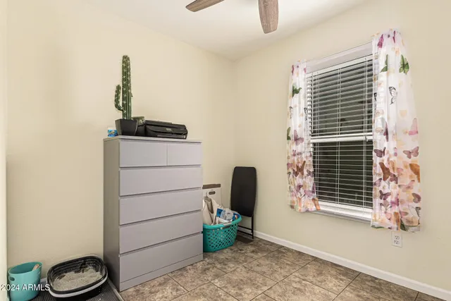 a bathroom with a granite countertop sink toilet mirror and shower