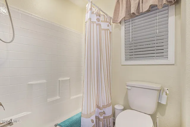 an empty room with closet and a bathroom