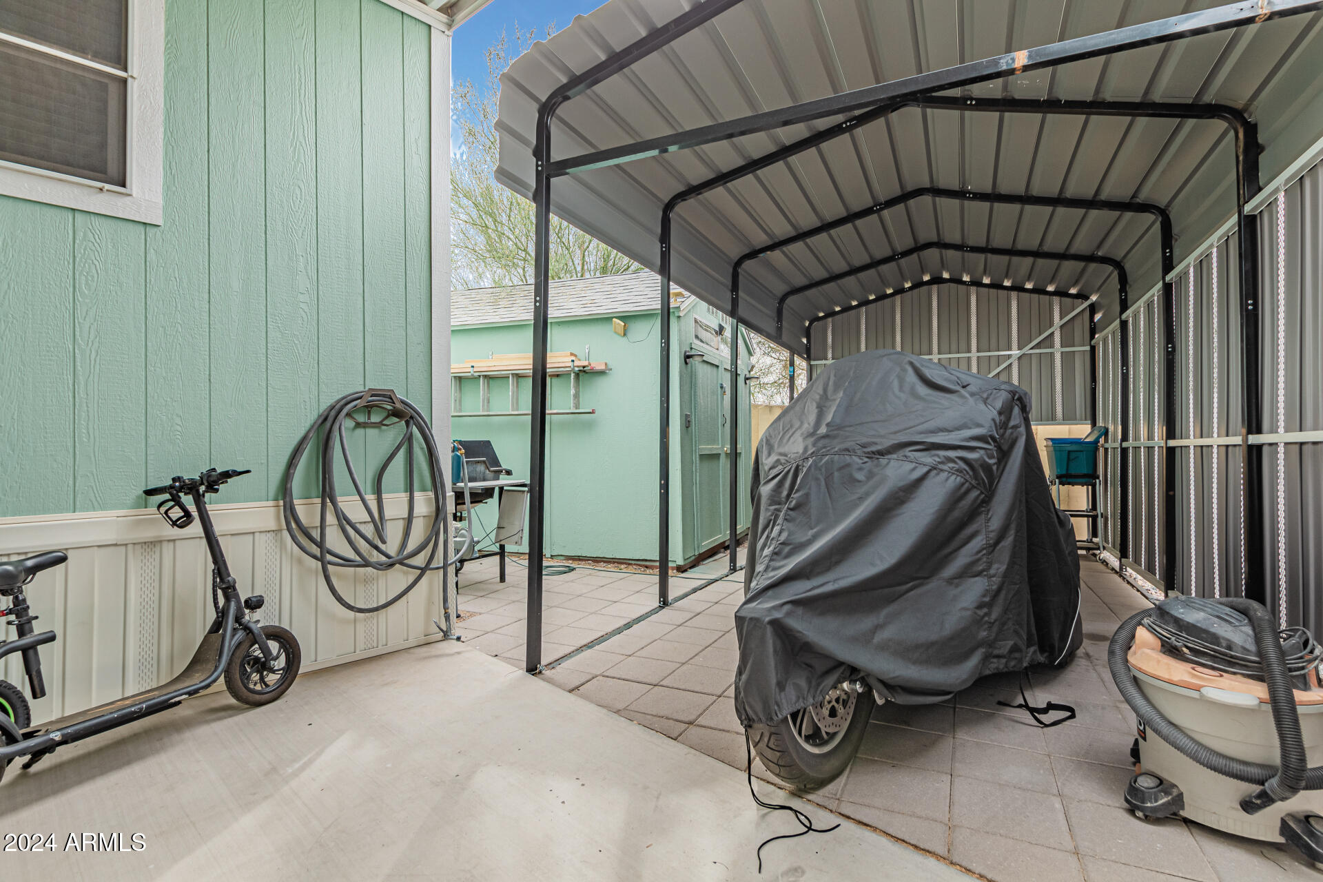 10220 East Apache Trail, Unit 213 Apache Junction, AZ 85120 - Photo 4 of 30 a view of an outdoor space with wooden floor and a tub