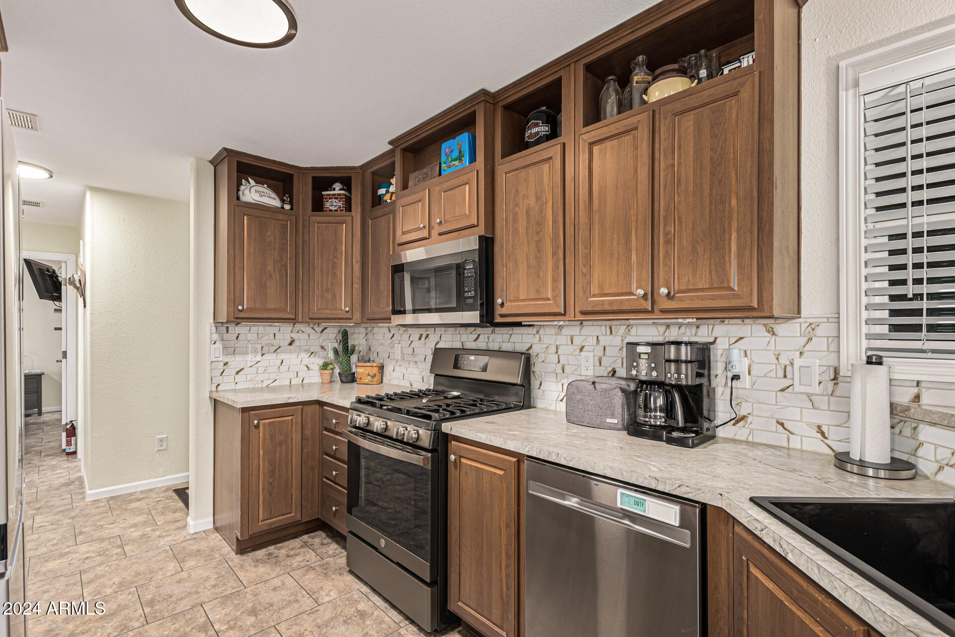 10220 East Apache Trail, Unit 213 Apache Junction, AZ 85120 - Photo 7 of 30 a kitchen with stainless steel appliances granite countertop a sink stove and cabinets