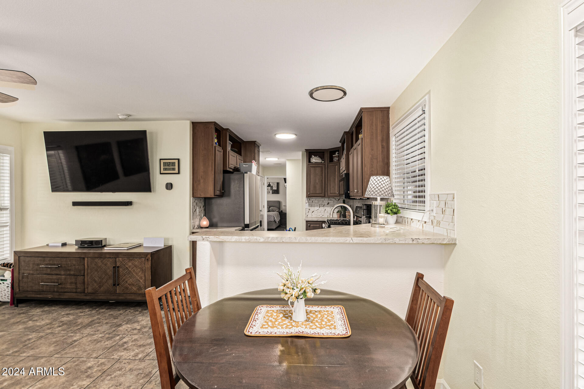 10220 East Apache Trail, Unit 213 Apache Junction, AZ 85120 - Photo 9 of 30 a living room with furniture and a flat screen tv