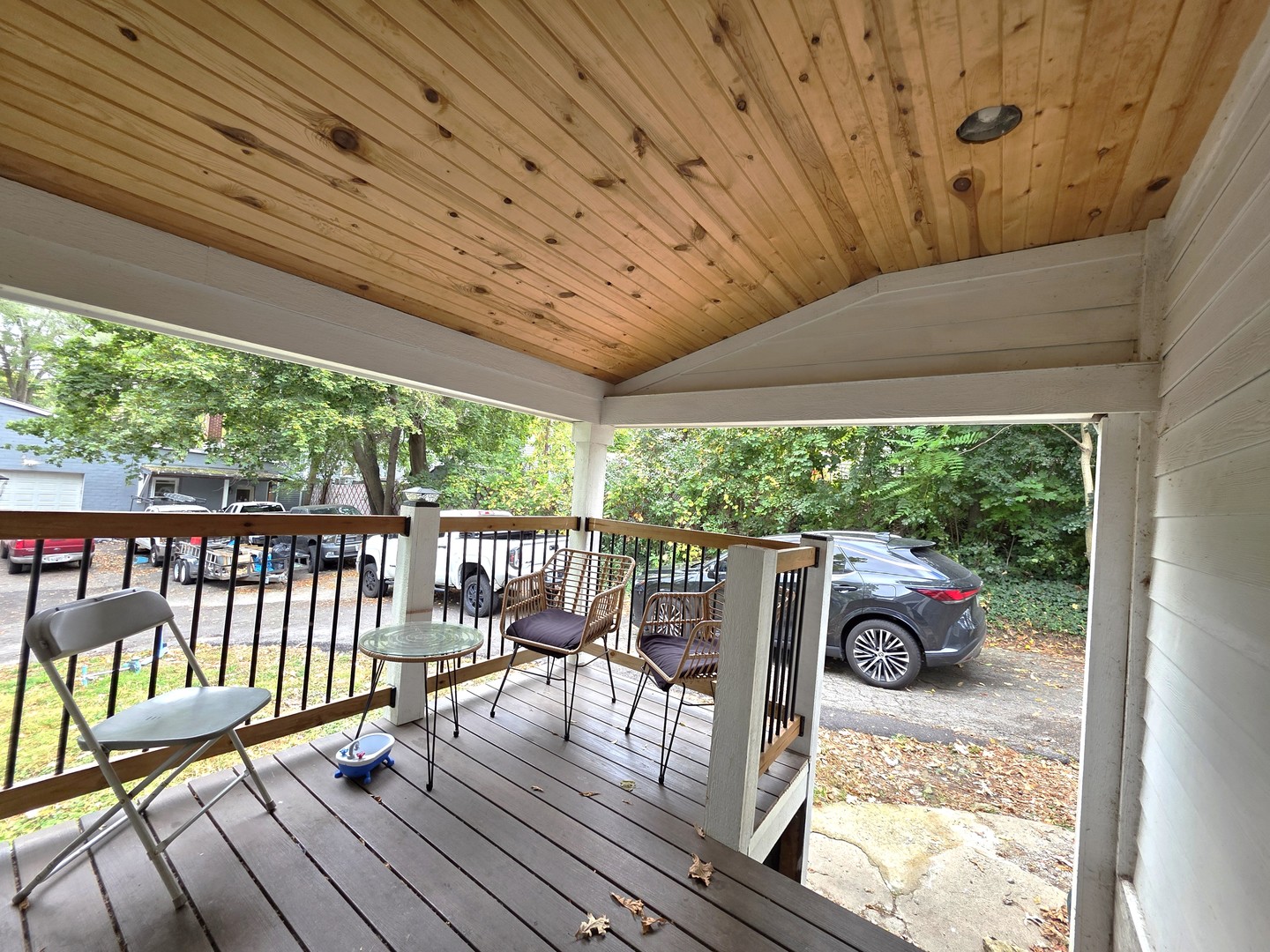 9 North Jackson Street Elgin, IL 60123 - Photo 11 of 13 a view of a chairs and table in patio with wooden floor