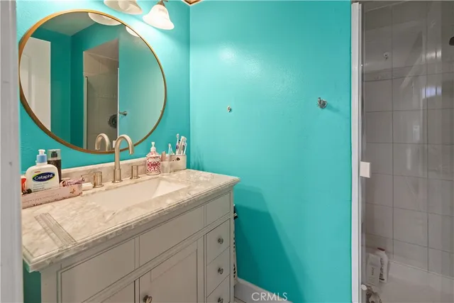 a bathroom with a sink and mirror