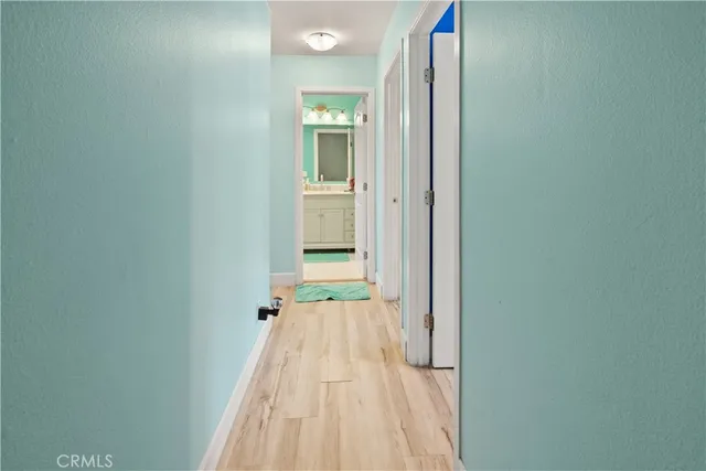 a view of a bedroom from a hallway