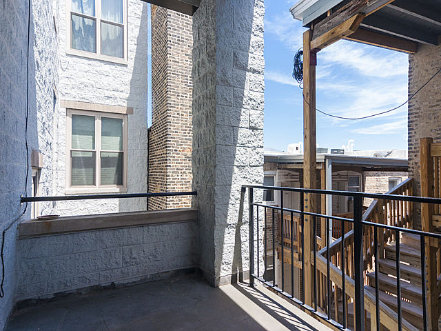 3113 West Lawrence Avenue, Unit D302 Chicago, IL 60625 - Photo 16 of 16 a view of a balcony with a potted plant